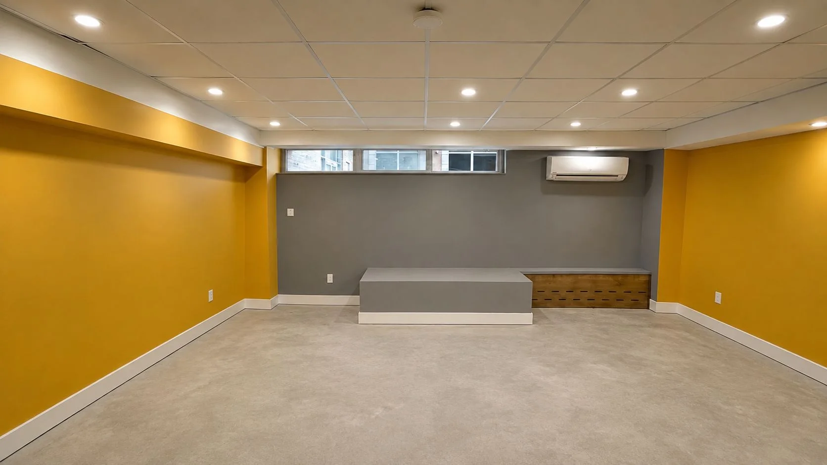 Finished basement renovation with recessed lighting, drop ceiling and new flooring by Master Icon Renovation Group