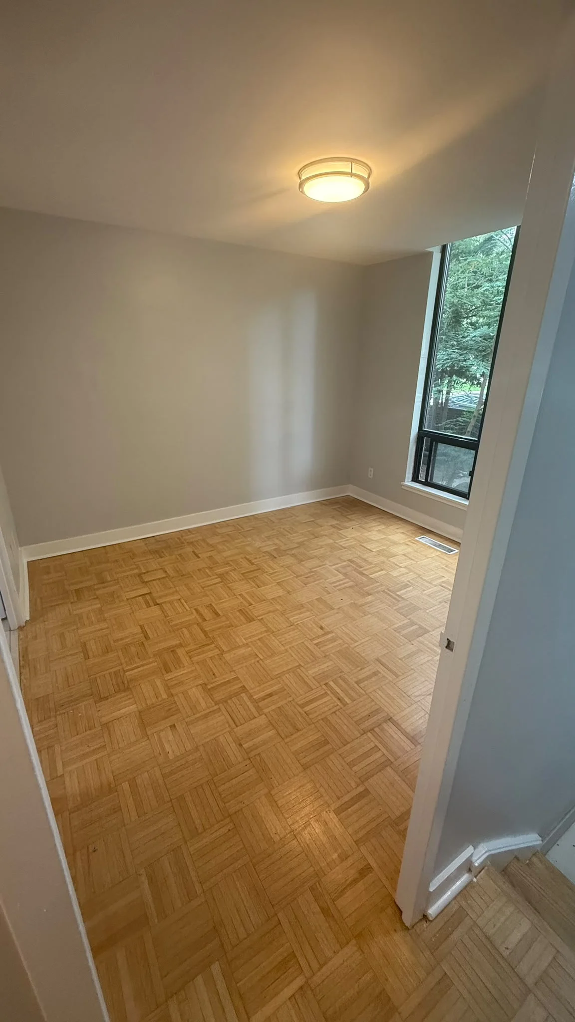 Freshly painted interior with smooth grey walls and white trim by Master Icon Renovation Group